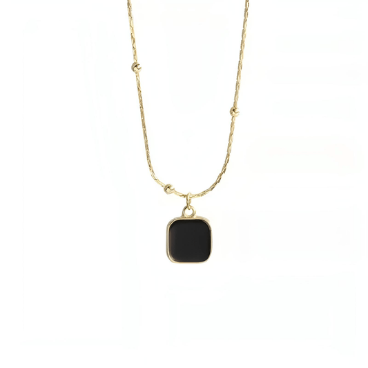 Features a captivating pendant adorned with a striking onyx stone, exuding timeless elegance and allure. The 18K gold-plated necklace is composed of a delicate rosary chain made from durable stainless steel, offering a perfect blend of beauty and longevity. The lobster clasp closure with extension ensures an adjustable fit, making this enchanting necklace a versatile and sophisticated addition to your jewelry collection.